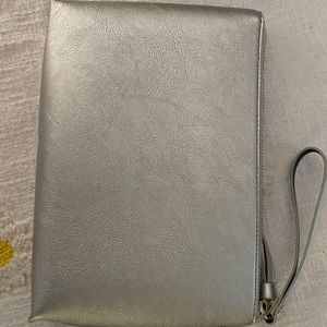 Silver vegan leather wristlet.